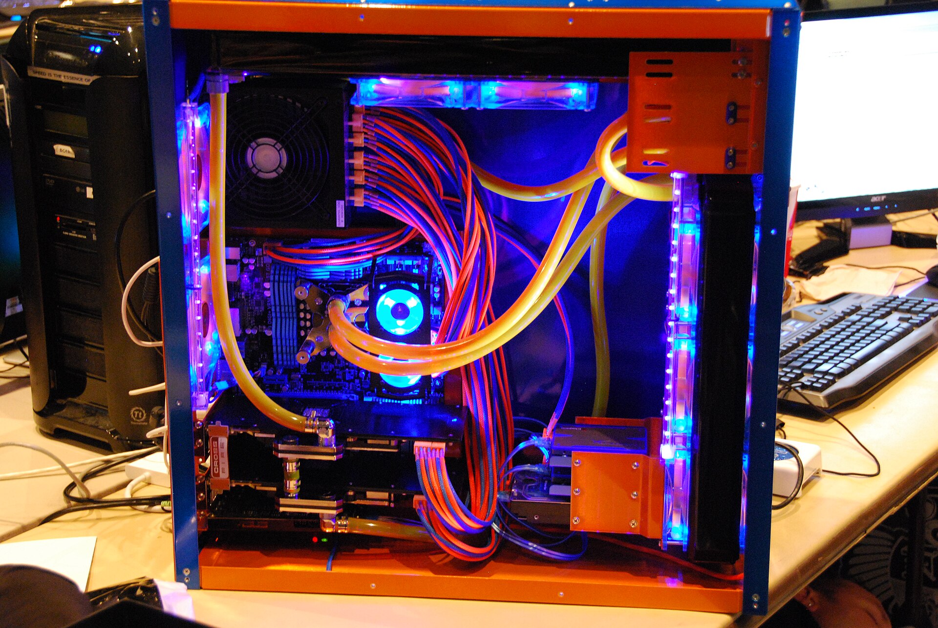 Open desktop computer with liquid-cooling tubing